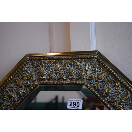 290 - A bevelled edge glass mirror with brass frame. 76cm x 45cm.