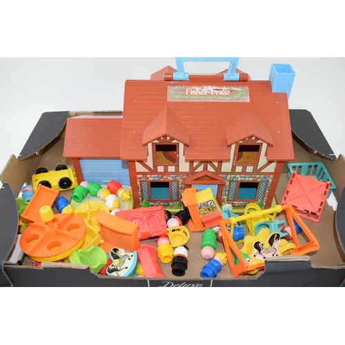 303 - A Vintage Fisher Price 'Little People Play Family House 952' 1987 together with a large number of ac... 