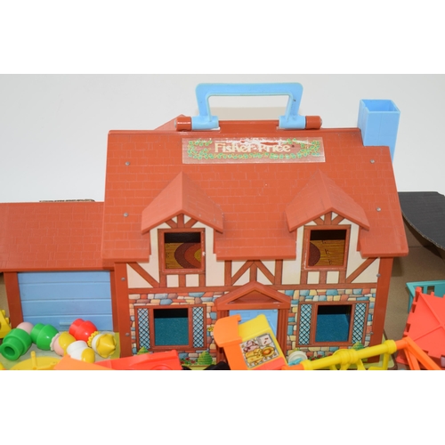 303 - A Vintage Fisher Price 'Little People Play Family House 952' 1987 together with a large number of ac... 