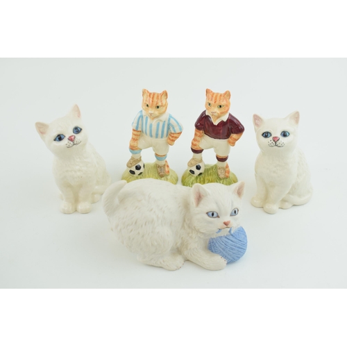 1 - A collection of Beswick items to include Beswick cats, two John Beswick 'Sporting Cats' and a Aynsle... 