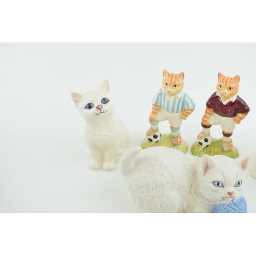 1 - A collection of Beswick items to include Beswick cats, two John Beswick 'Sporting Cats' and a Aynsle... 