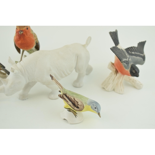 107 - Goebel pottery to include a matte white rhino and five birds (6).