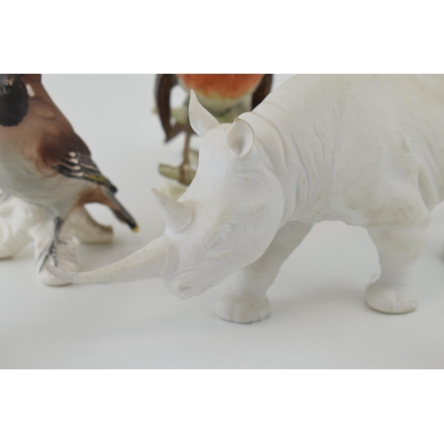 107 - Goebel pottery to include a matte white rhino and five birds (6).