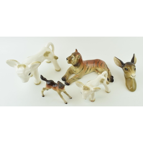 124 - A collection of Midwinter pottery figures to include a foal, a deer wall hanging, a tiger and a styl... 