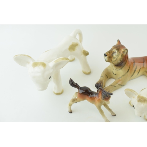 124 - A collection of Midwinter pottery figures to include a foal, a deer wall hanging, a tiger and a styl... 