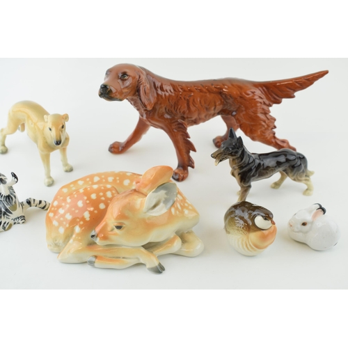 134 - Pottery animals to include a large USSR deer and others, an Italian Ronzan figure of a setter, 23cm ... 