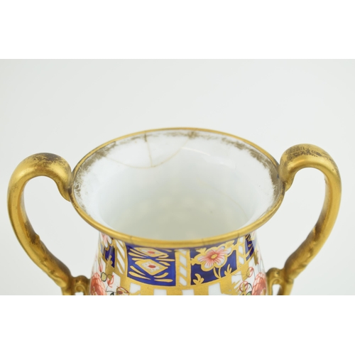 162 - Royal Crown Derby imari pottery to include a double handled trophy cup, 16cm tall, a two handled vas... 