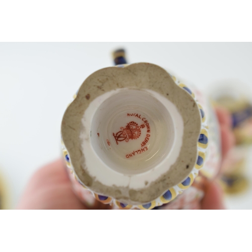 162 - Royal Crown Derby imari pottery to include a double handled trophy cup, 16cm tall, a two handled vas... 