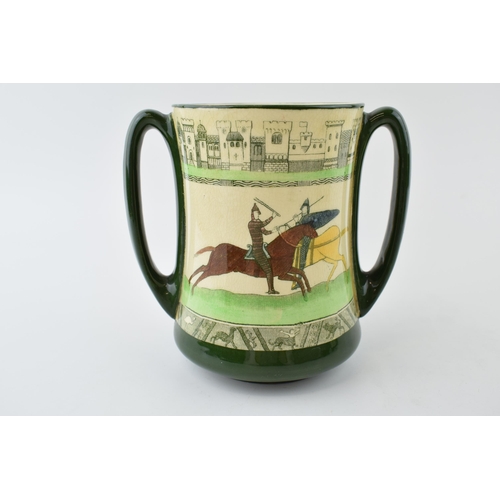 180 - Royal Doulton two handled loving cup 'Battle of Hastings 1066 from the Bayeux Tapesty', 15cm tall.