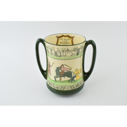 180 - Royal Doulton two handled loving cup 'Battle of Hastings 1066 from the Bayeux Tapesty', 15cm tall.