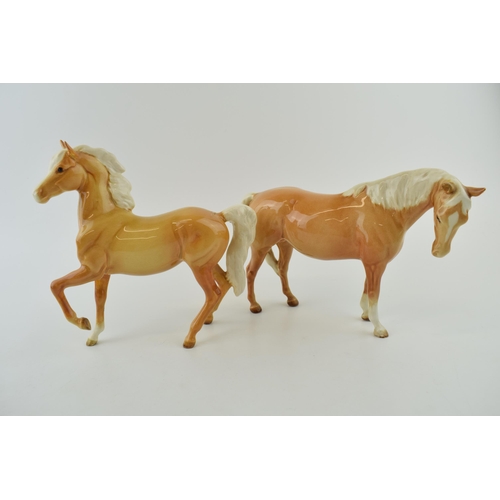 53 - Two Beswick palomino horses to include a prancing arab and a mare facing right (2 - both restored).