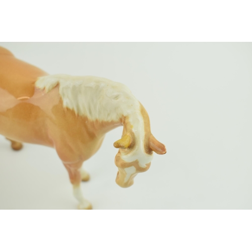 53 - Two Beswick palomino horses to include a prancing arab and a mare facing right (2 - both restored).