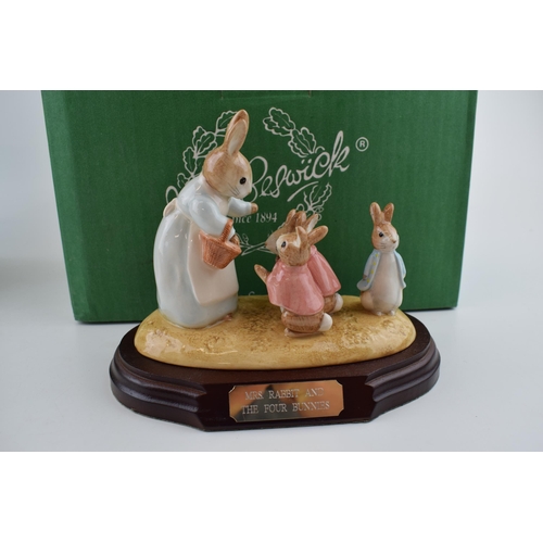 62 - Boxed Beswick Beatrix Potter figure Mrs Rabbit and the Four Bunnies with wooden plinth.