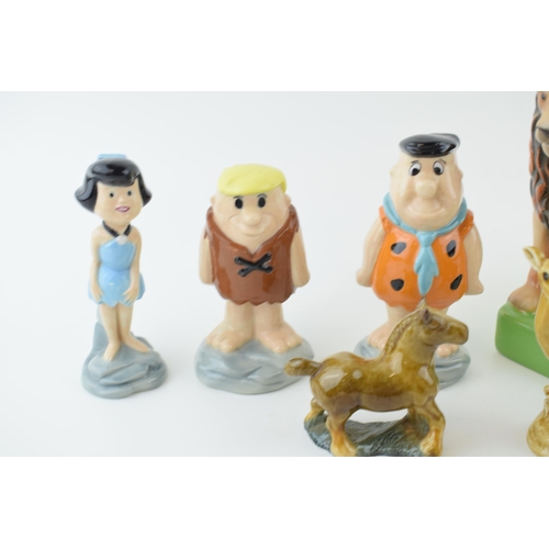 79 - 9 x Wade figures of Fred, Wilma and Barney from the Flintstones Collection, and a Duck, a Lion, a Po... 