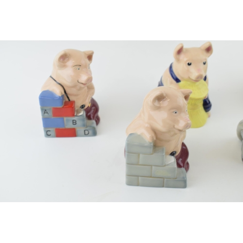 82 - Wade Three Little Pig figures to include the House of Brick x 2, the House of Straw, the House of Wo... 