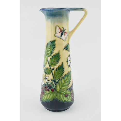 90 - Moorcroft ewer / jug decorated with honey boy design, 'Fruit Garden', 24cm tall (silver line).