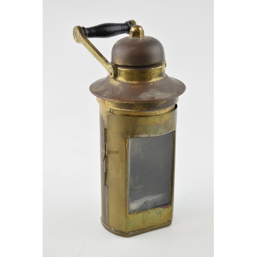 356 - A brass ships Binnacle oil lamp with burner dated 1943 L.S. Co Ltd. Height 26cm.