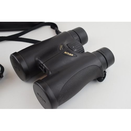 359 - Nikon 8 x 42 binoculars with case and strap.