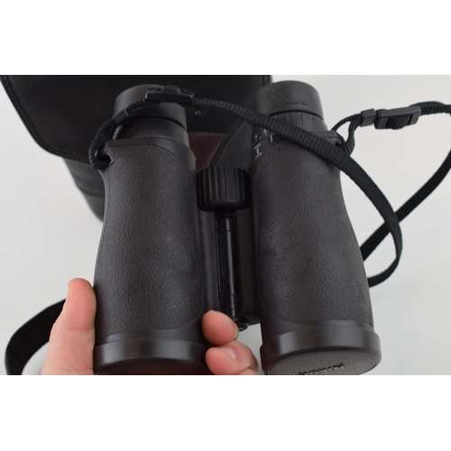 359 - Nikon 8 x 42 binoculars with case and strap.