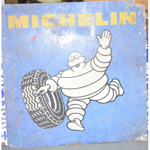 360 - A Michelin sign on aluminium depicting Bibendum Michelin Man with tyre on blue ground with yellow sc... 