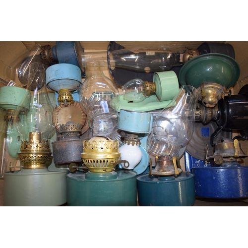 459 - A mixed collection of vintage and antique tin Oil Lamps with glass chimneys and parts