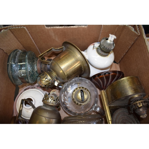 460 - A mixed collection of vintage and antique tin, pottery and brass oil lamps with glass chimneys and p... 