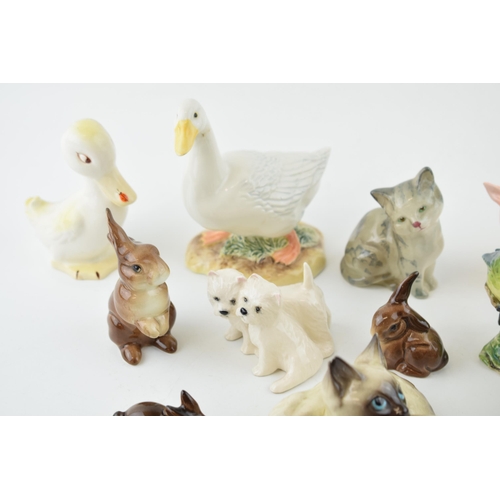 5 - A collection of Beswick to include a comical duck 160, cats, rabbits and two modern Beswick pieces t... 