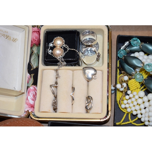 562 - A collection of vintage costume jewellery to include bracelets, bangles, necklaces, rings, earrings ... 