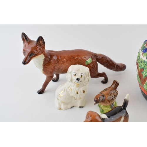 7 - Beswick to include a large fox, a beagle, a pair of small Staffordshire dogs, and others with a pain... 