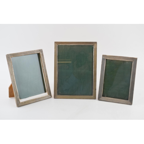 548 - A trio of Art Deco graduated 800 silver engine turned photo frames c1930s. 15.5cm x 11.5cm, 17cm x 1... 