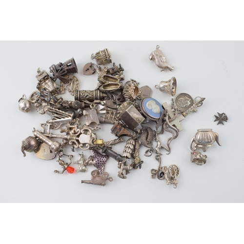 557 - A large collection of silver charms to include animals, tankards and others, 168g.