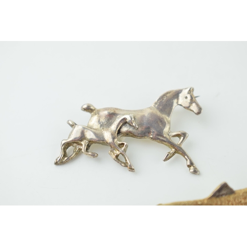 561 - A quality silver with gold appearance salmon / fish bar brooch with a similar silver brooch of a run... 