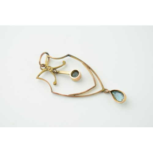 563 - A 9cy yellow gold Art Nouveau drop pendant set with two aquamarine stone. Weight 1.3 grams.