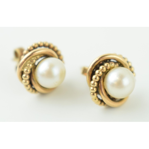 564 - A pair of 9ct yellow gold pearl earrings. Weight 4.3 grams.