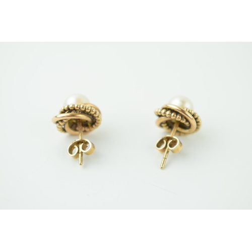 564 - A pair of 9ct yellow gold pearl earrings. Weight 4.3 grams.