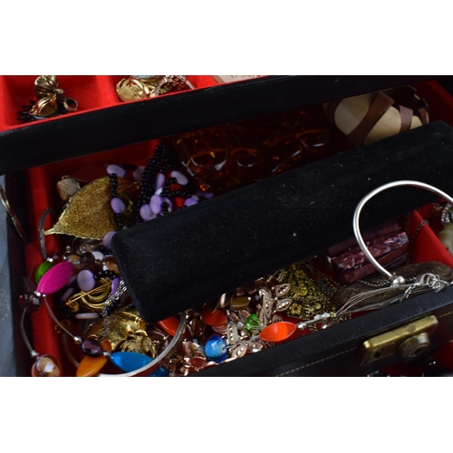 568 - A jewellery box of costume jewellery to include a metal albert watch chain with a silver fob, a Jady... 