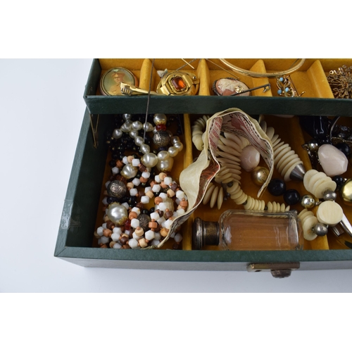 569 - A jewellery box with costume jewellery to include a silver topped glass jar, hat pins, a bronzed sma... 