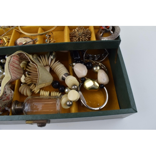 569 - A jewellery box with costume jewellery to include a silver topped glass jar, hat pins, a bronzed sma... 