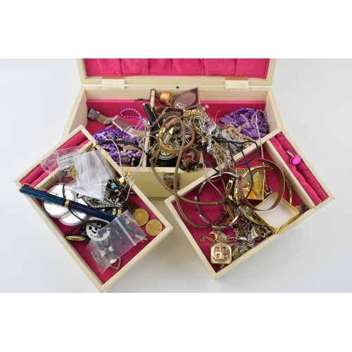 570 - A jewellery box to include costume jewellery such as a silver crucifix on chain, silver 925 rings, w... 