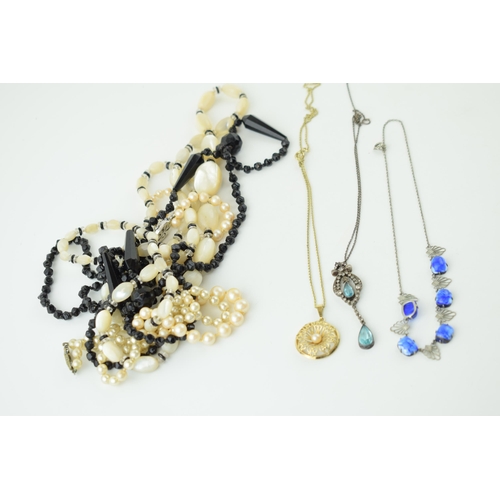 572 - Costume jewellery to include a silver Art Deco suspended pendant, pale blue stone, with other items.