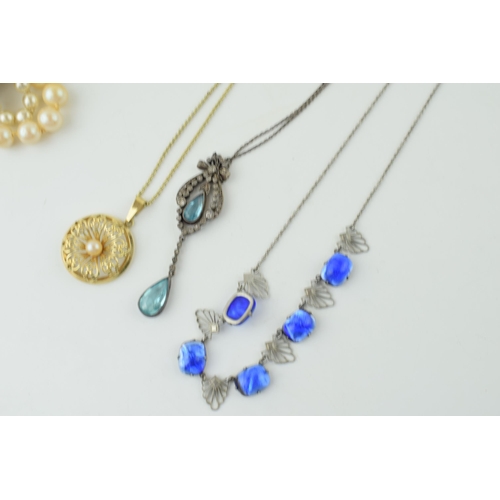 572 - Costume jewellery to include a silver Art Deco suspended pendant, pale blue stone, with other items.