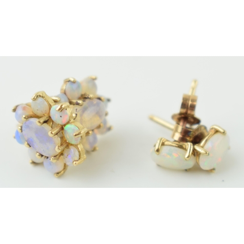 576 - Two pairs of 9ct gold opal earrings, one pair of floral form, 2.2g (two pairs).