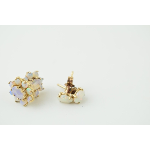 576 - Two pairs of 9ct gold opal earrings, one pair of floral form, 2.2g (two pairs).