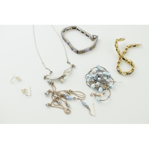 587 - A collection of silver jewellery, with varying simulated pearls and similar, with a silver marcasite... 