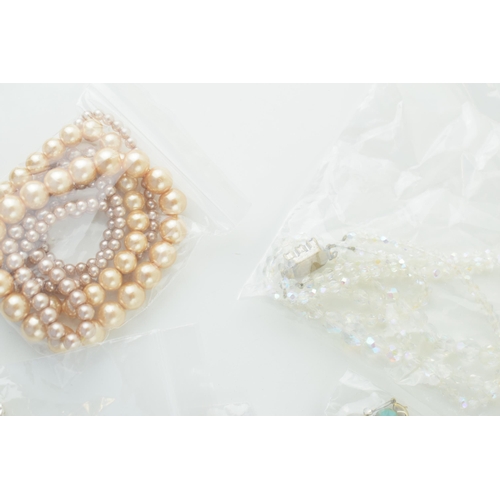 588 - A collection of costume jewellery to include simulated pearls, necklaces, earrings and others.