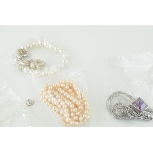 588 - A collection of costume jewellery to include simulated pearls, necklaces, earrings and others.