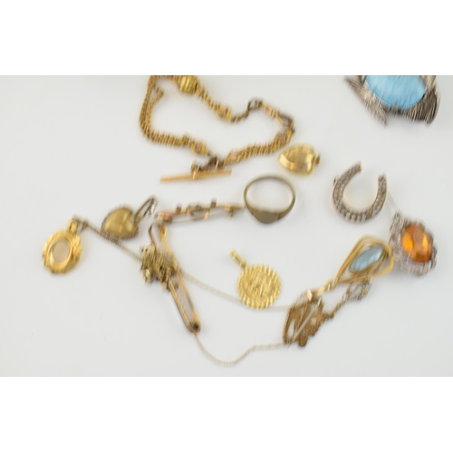 593 - A collection of Victorian and later costume jewellery to include a gold plated albertina watch chain... 