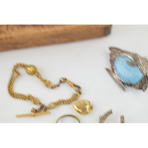 593 - A collection of Victorian and later costume jewellery to include a gold plated albertina watch chain... 