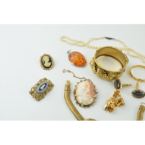 594 - Costume jewellery to include a snake articulated bracelet, a grape and vine bangle, cameos and other... 