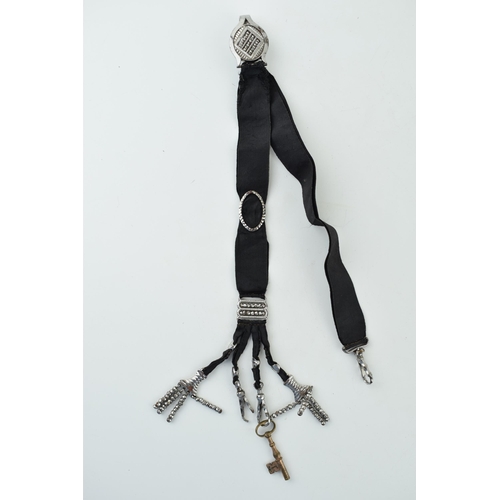 595 - Victorian cut steel chatelaine, 25cm long.